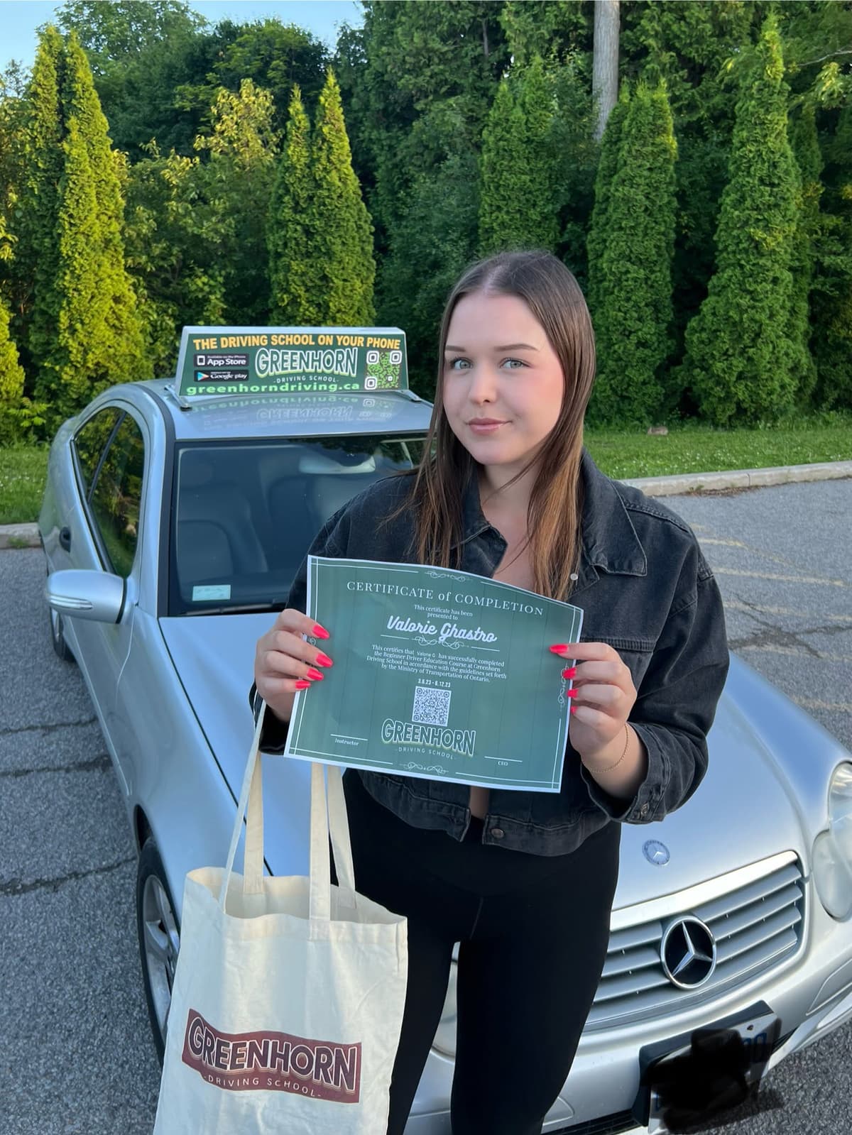 Greenhorn student holding their completion certificate